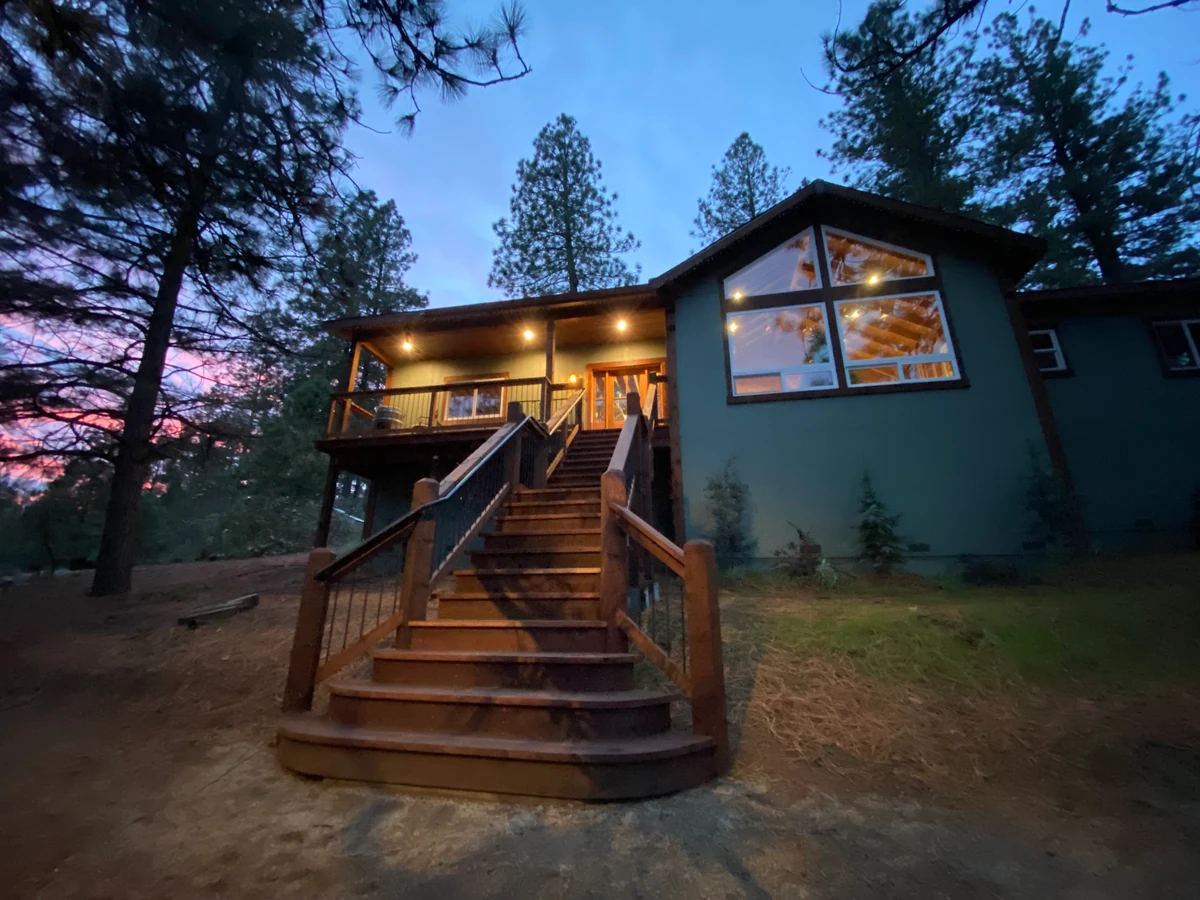 Completed new home at sunset, framed and built by Monument Construction in Colfax, CA